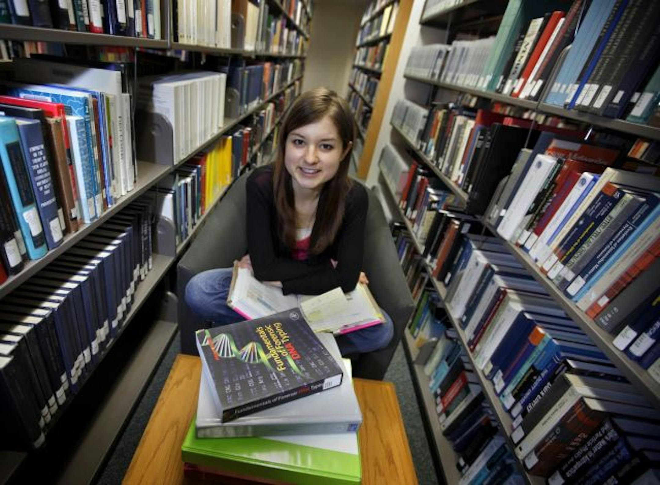 University of Minnesota freshman Elin Mixer is among the students who prefer printed books to e-books. Shown studying at the U's Walter Library, she says she likes being able to highlight passages and write notes in book margins.