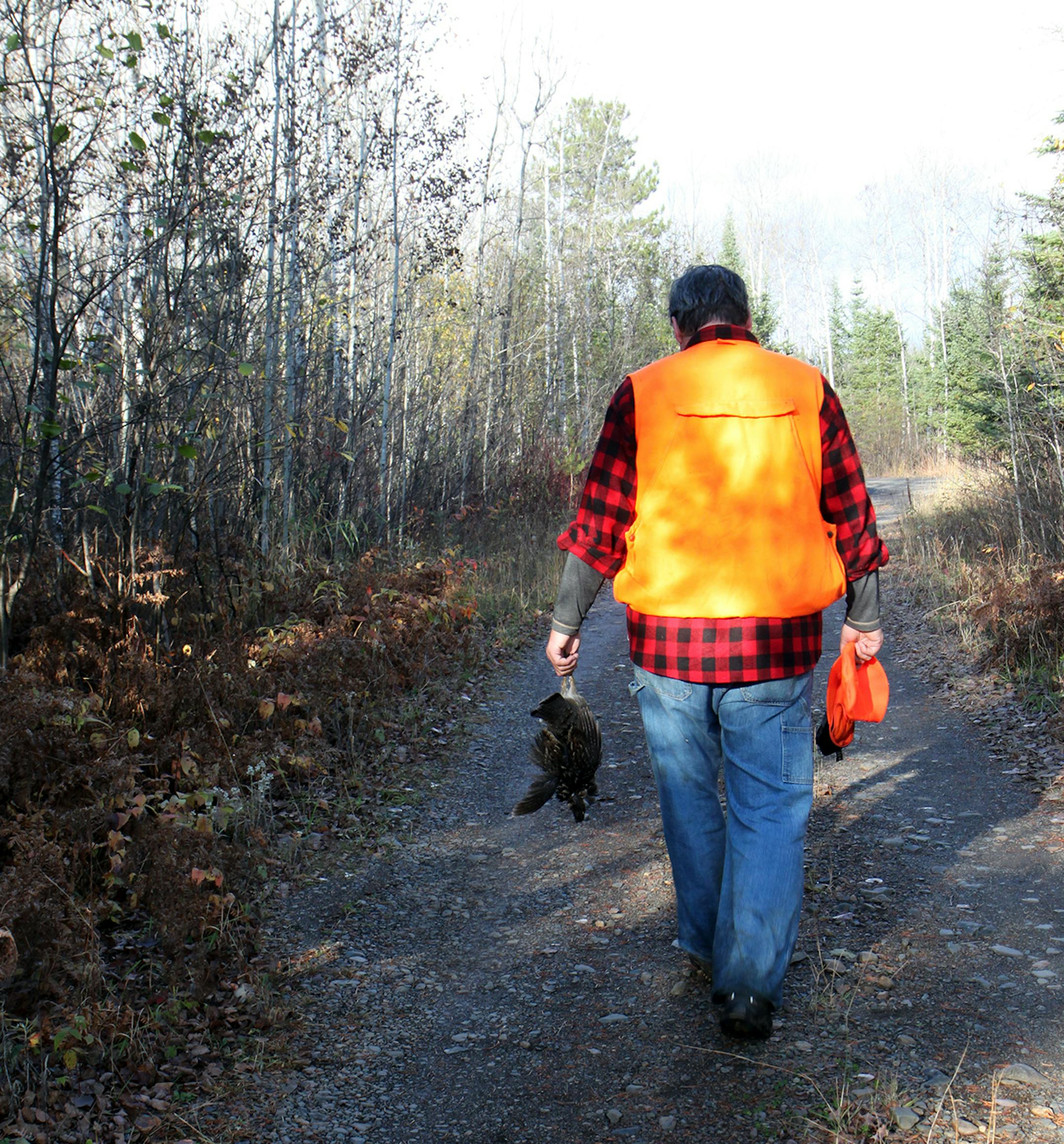 Photo by Mary Jo Hoffman, Special to the Star Tribune Steve Hoffman, with his grouse catch, for hunting story by Steve Hoffman.