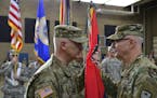 Brig. Gen. Jon Jensen took command of the Minnesota National Guard's 34th Red Bull Infantry Division from Maj. Gen. Neal Loidolt during a change of co