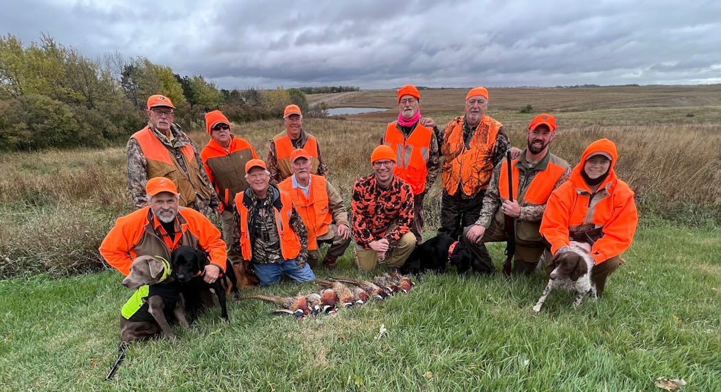 Hunting with Dennis Anderson in extreme western Minnesota Saturday were, back row, standing, from left, Ken Meyer, Tim Pengra, Bob O’Neel, Gary DeAustin and Bob DeAustin. Front row, kneeling, are Deano Kaye, Nick Sovell, Denny Lien, Nicholas Sovell, Chuck Meek, and Cindy DeAustin. Not shown is Kris DeAustin.