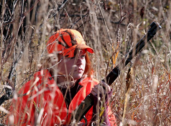 Young woman deer hunting