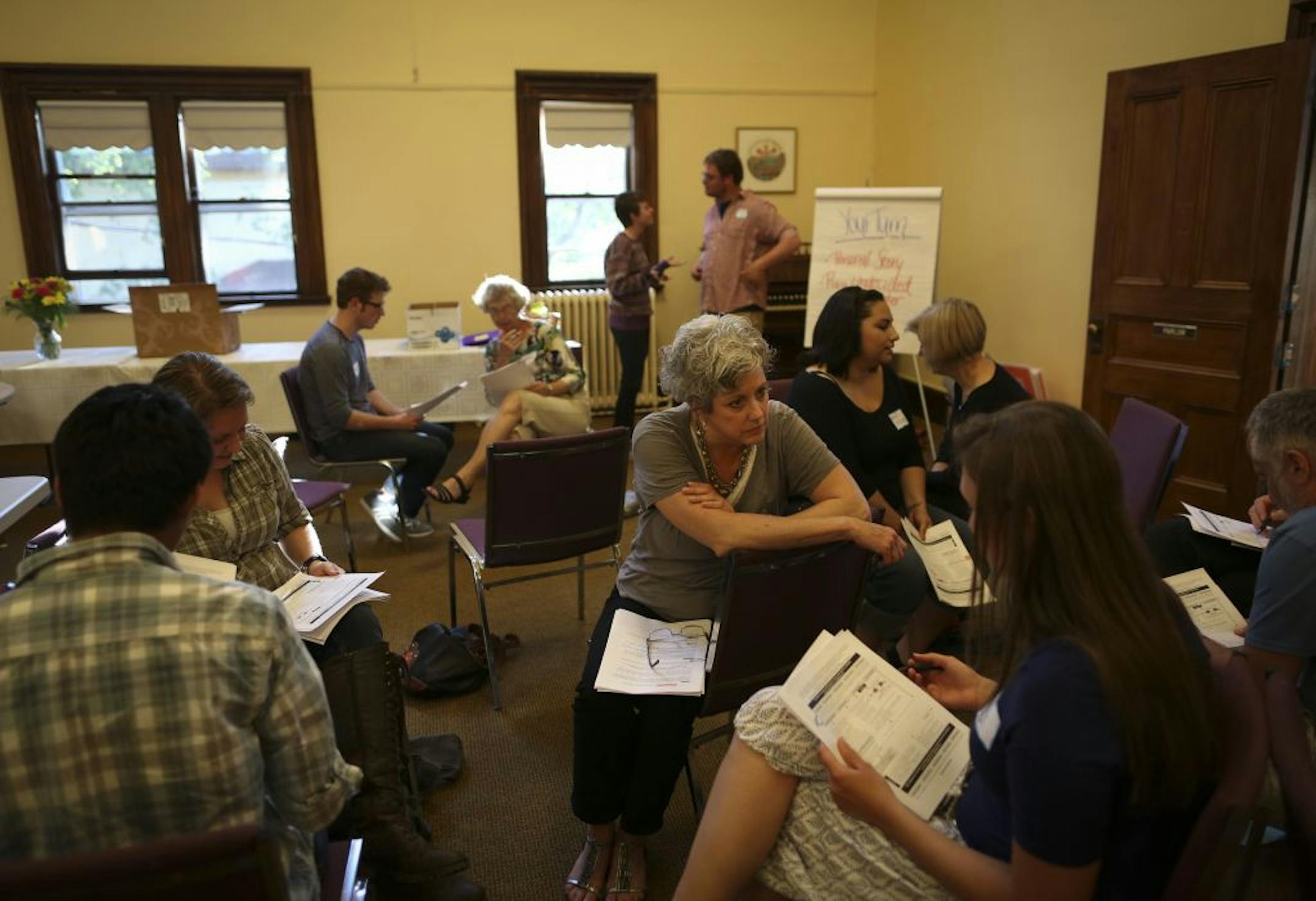Minnesotans United for All Families, the group opposed to the marriage amendment, is opening offices around the state in crucial areas including in Northfield where for now are running a call center out of a church. A group of volunteers and staffers practiced with each other what they would say on calls on Tuesday, June 12, in Northfield, Minn.