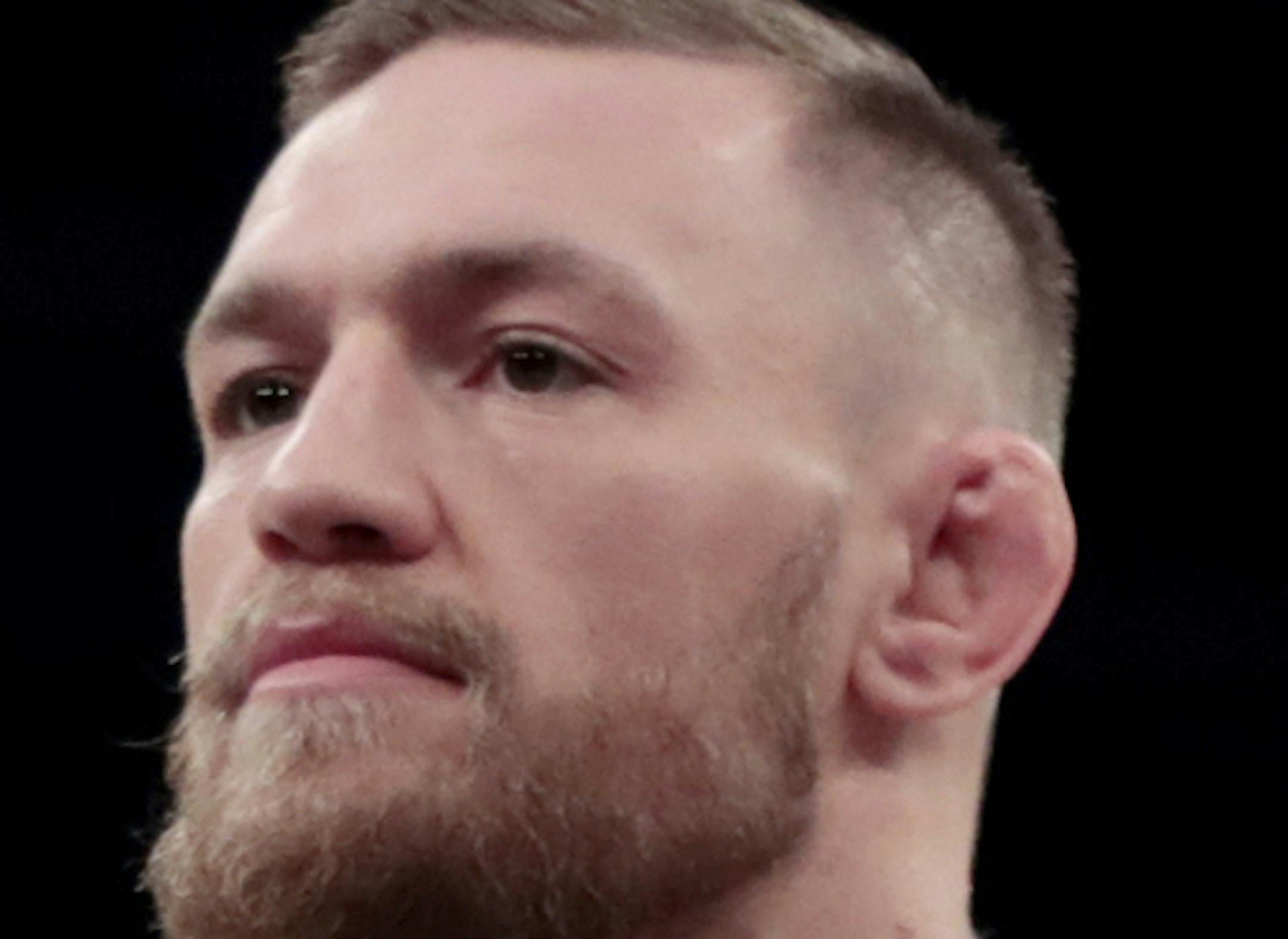 FILE - In this Nov. 9, 2016, file photo, Conor McGregor gestures toward fans while working out at Madison Square Garden in New York. McGregor has come to an agreement with UFC that has moved a proposed fight with Floyd Mayweather Jr. closer to reality. (AP Photo/Julio Cortez, File) ORG XMIT: NY159