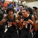 Hopkins players, including Ezekiel Nnaji (22) and Andy Stafford (11) mugged for a television camera after earning a trip to the state tournament with 