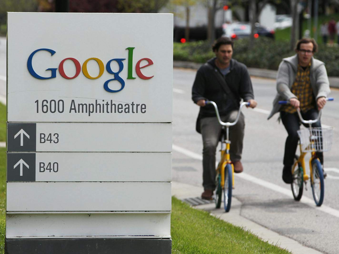 Google workers ride bikes outside of Google headquarters in Mountain View, Calif., Thursday, April 12, 2012. Google Inc. said Thursday that it earned $2.89 billion, or $8.75 per share, in the first quarter. That&#xed;s up from $1.8 billion, or $5.51 per share, a year earlier. (AP Photo/Paul Sakuma)