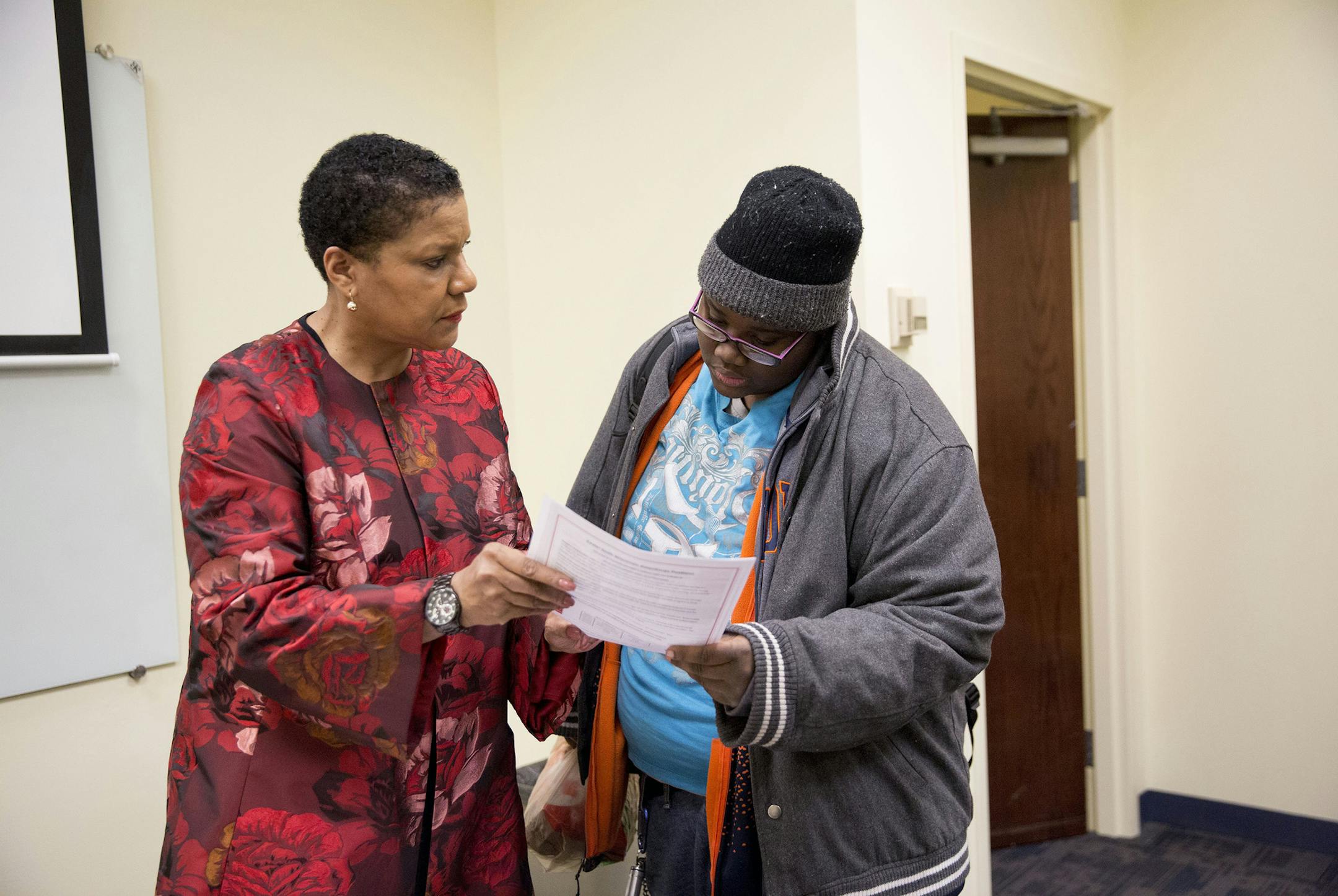 From right, Latia Crockett-Holder, 23, talks with her sociology teacher Joanne Howard during class at MacCormac College Tuesday, Feb. 2 2016, in Chicago. Holder has been attending MacCormac College since July of 2015. (Armando L. Sanchez/Chicago Tribune/TNS)