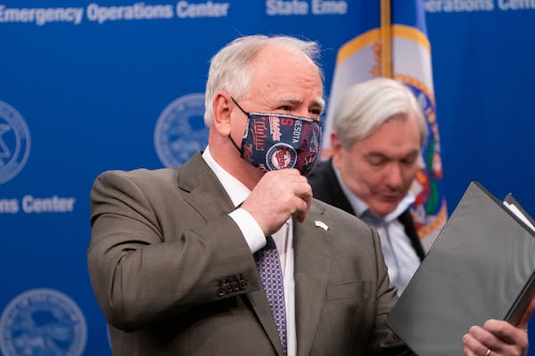 Gov. Tim Walz wore a mask in and out of a news conference on April 22, 2020. His decision on a statewide mask mandate could come in a matter of days.