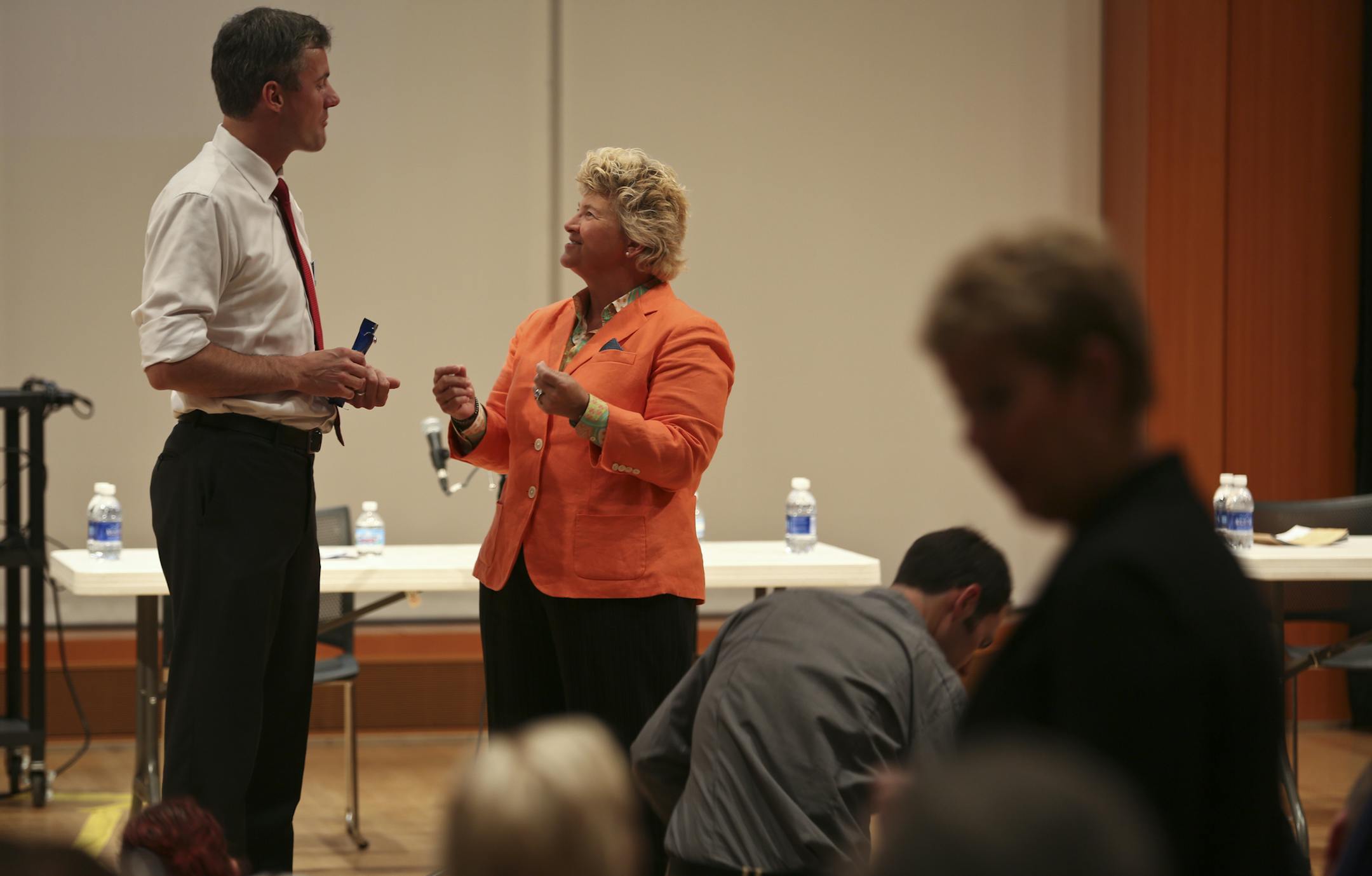 A mayoral forum based on the arts was held with several candidates for mayor of Minneapolis at the MacPhail Center in Minneapolis, Minn., on Thursday, September 12, 2013. Before it began candidates Cam Winton and Stephanie Woodruff chatted on stage. ] (RENEE JONES SCHNEIDER • reneejones@startribune.com)