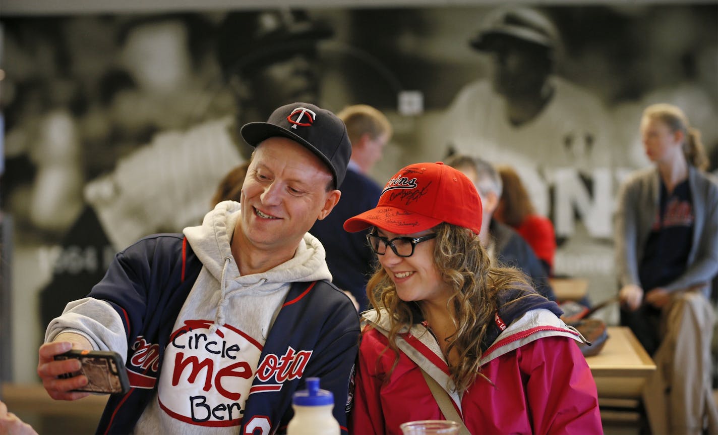 Twins fans Edward Listiko left and Jasmin Hass gathered in Legends Club at Target Field to watched their team open the season against the Detroit Tigers on the big screen at Target Field Monday April 6, 2015 in Minneapolis, Minnesota.