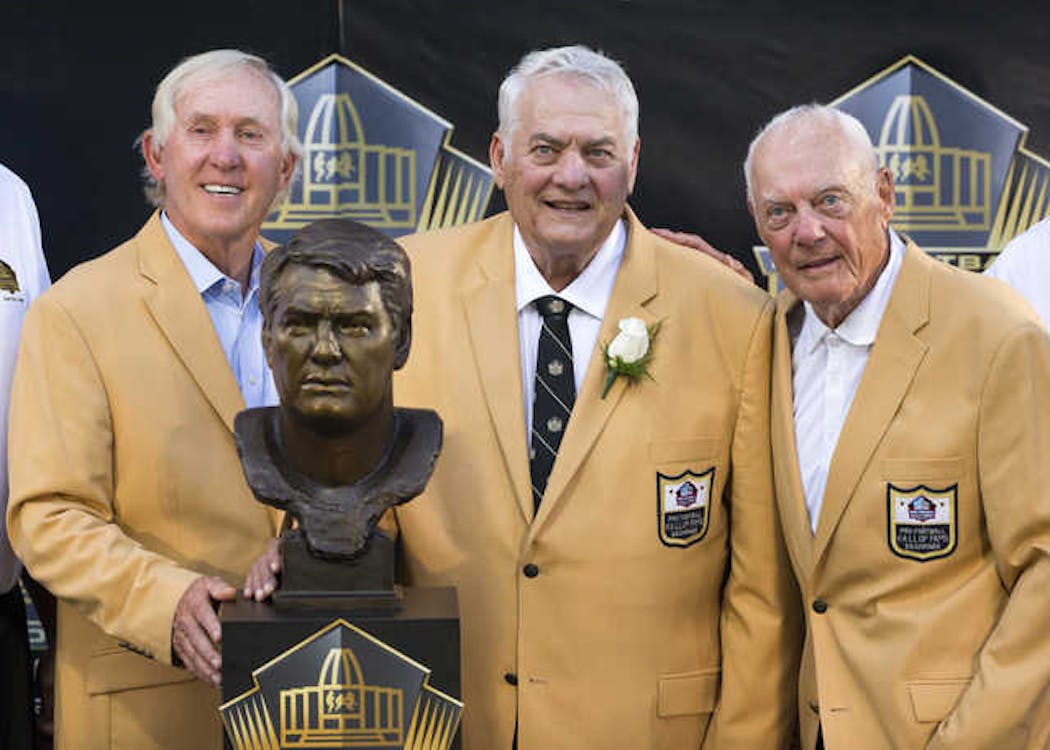 Mick Tingelhoff, flanked by fellow Pro Football Hall of Famers Fran Tarkenton and Bud Grant.