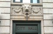 A lion guards the doorway of Duluth City Hall