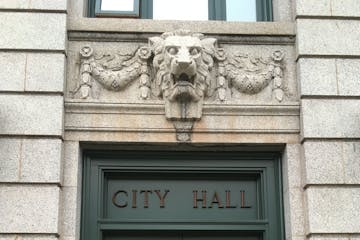 A lion guards the doorway of Duluth City Hall