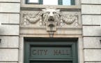 A lion guards the doorway of Duluth City Hall