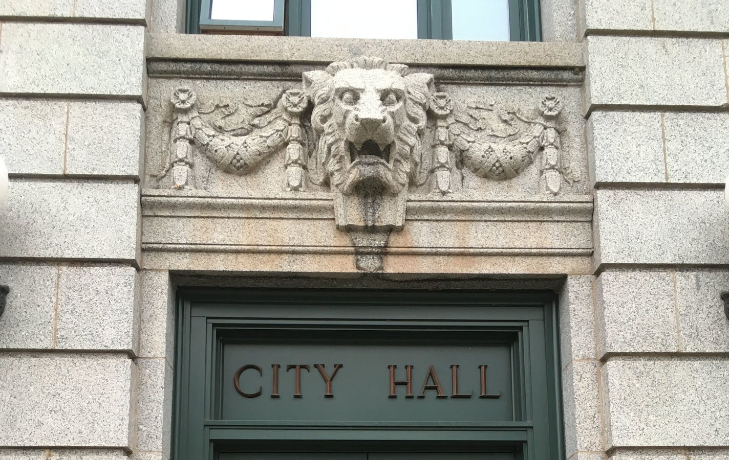 A lion guards the doorway of Duluth City Hall