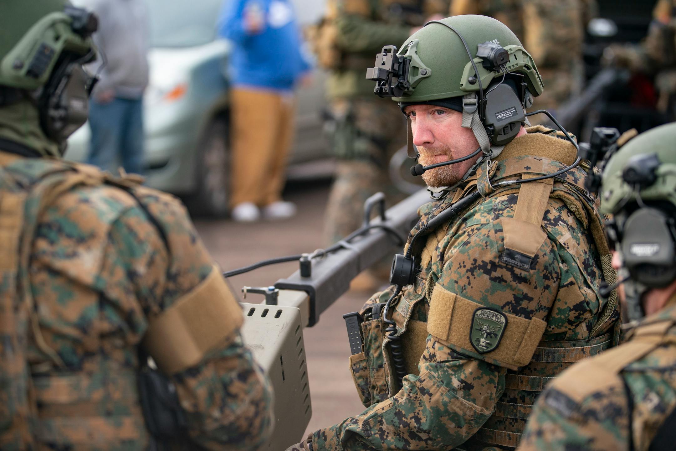 St. Louis County Sheriff officers worked on assembling a device to launch non-lethal smoke grenades into the gunman's home from the safety of their armored vehicle.