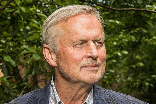 John Grisham, photographed in front of greenery