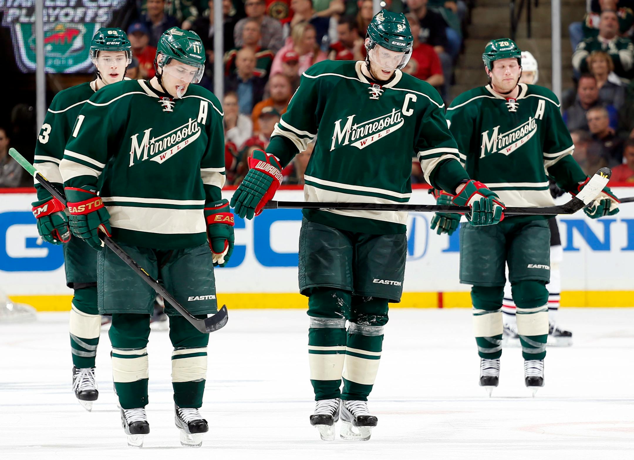 Minnesota Wild players Charlie Coyle (63), Zach Parise (11), Mikko Koivu (9) and Ryan Suter (20)