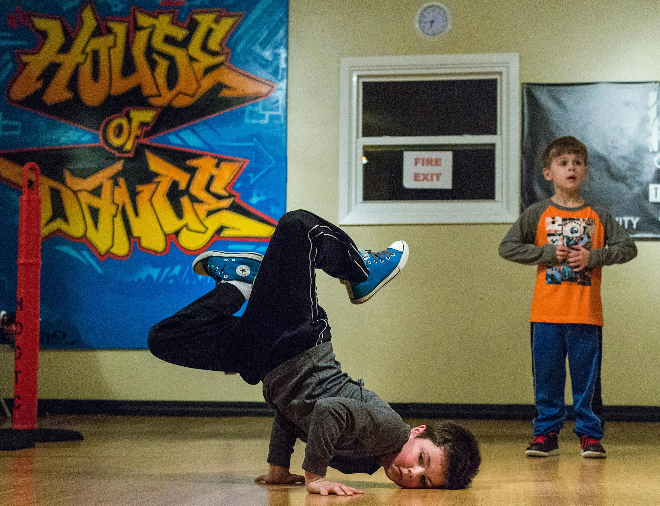 Paxton Mueller, age 7, dances during class at the House of Dance, Feb. 26. ] Elizabeth Brumley special to the Star Tribune * In a tiny walk-up studio on the back streets of Hopkins, a little slice of the 80s is lovingly preserved and passed on. The House of Dance teaches breakdancing -- a dance form that evokes images of MC Hammer parachute pants and spray-painted New York subway car.