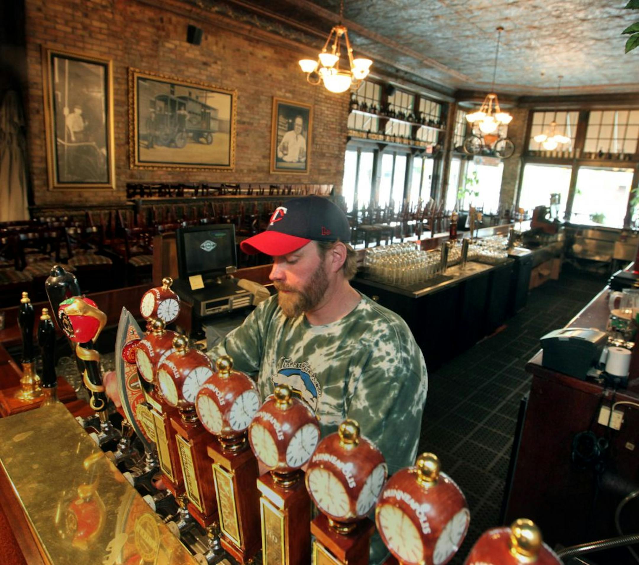 Mike Hoops, Head Brewer at theTown Hall Brewery, Minneapolis, pulls a sample brew.