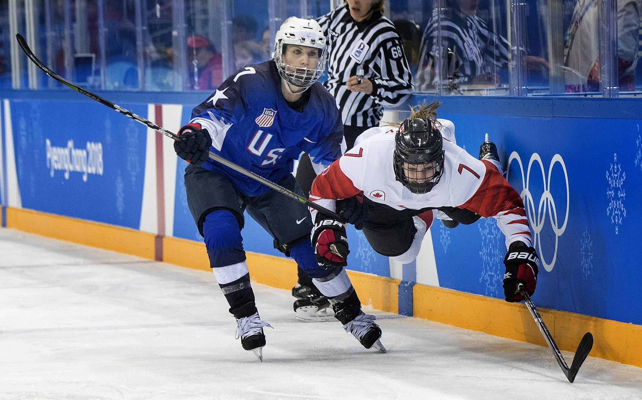 Monique Lamoureux-Morando (7) and Laura Stacey (7) collided in the second period.