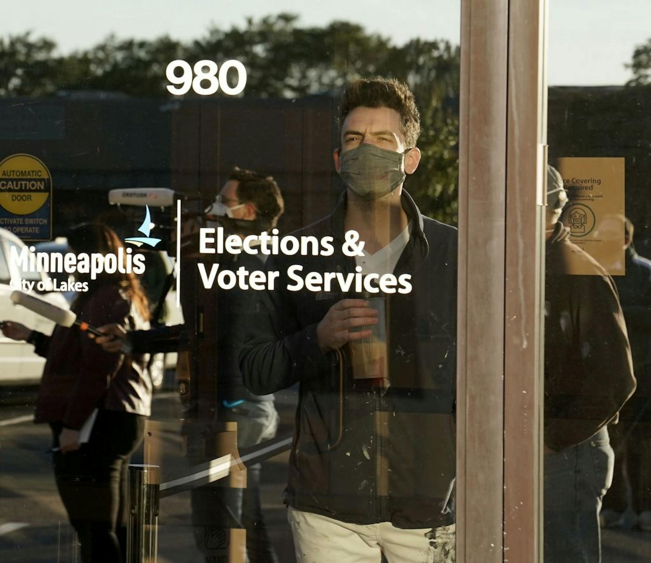 Jason Miller of Minneapolis was the first in line for early voting at Minneapolis Elections and Voter Services Friday in Minneapolis.