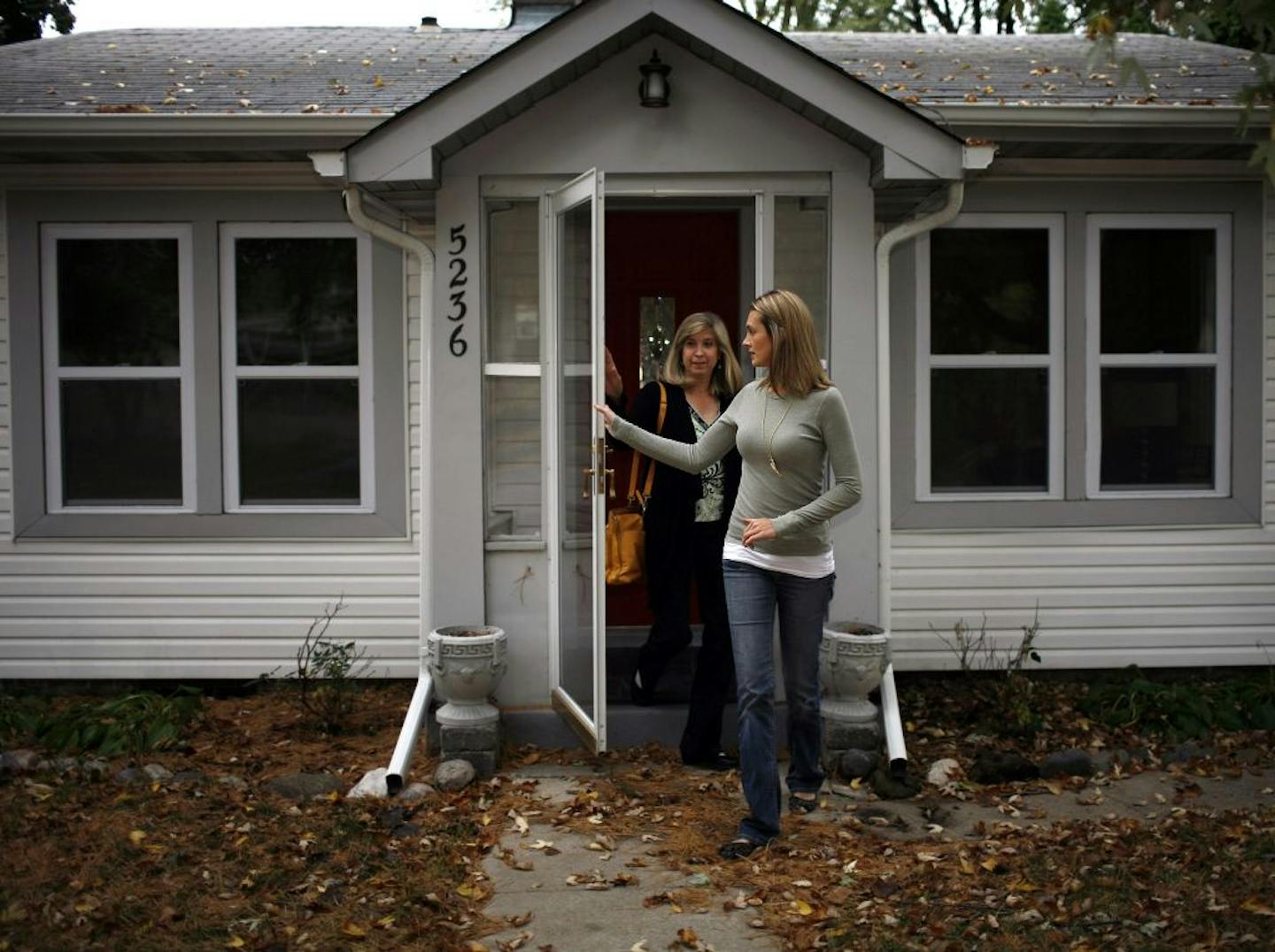 Jessica Harrison and her realtor, Barb Duthler (in black) toured Harrisons' newly purchased home. She closes in late October. Story is about stiff competition for houses priced at less than $150,000. Jessica Harrison has been on the hunt for a starter house for a couple years.