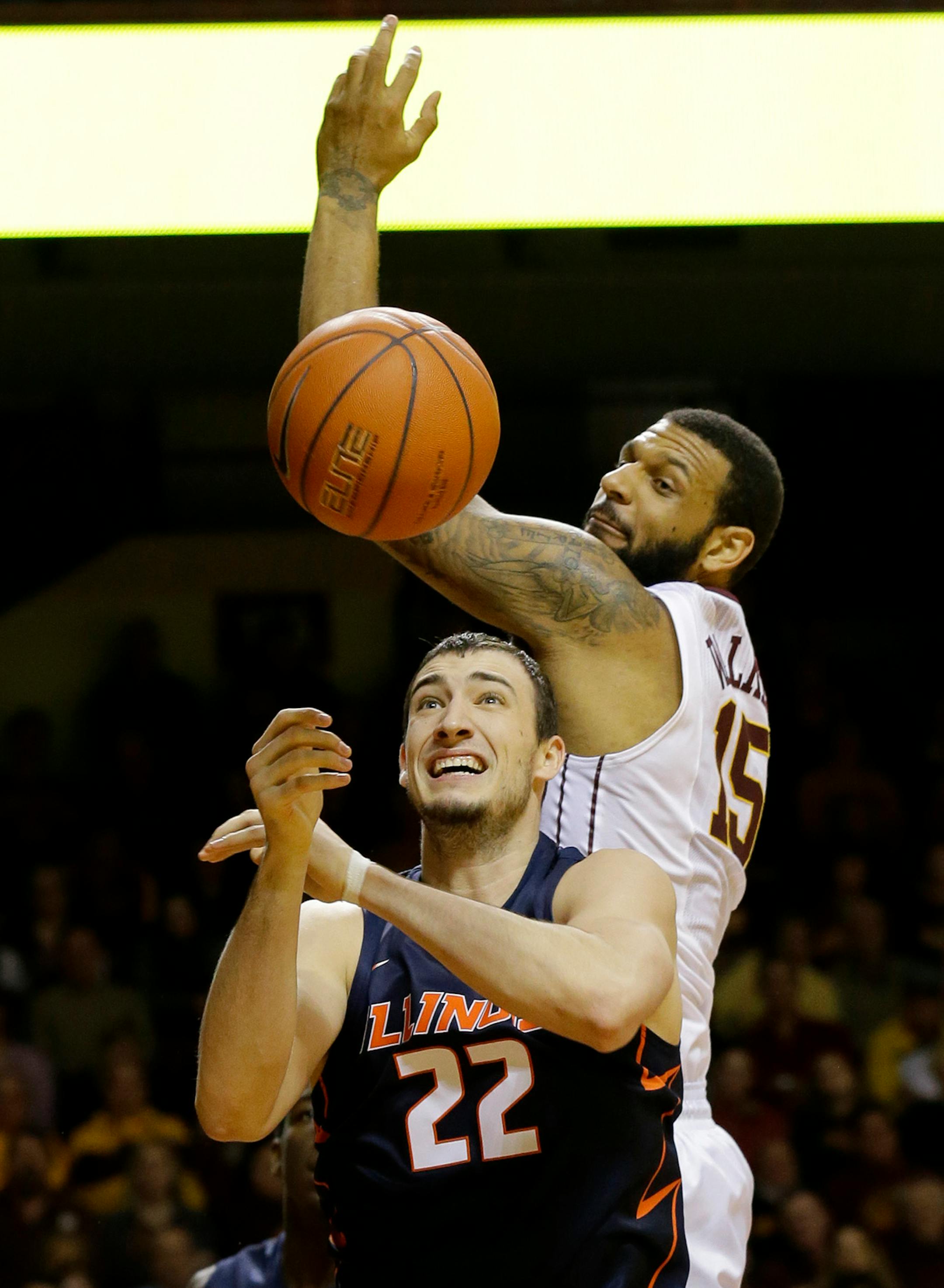 Minnesota forward Maurice Walker (15) and Illinois center Maverick Morgan (22) vie for a rebound during the second half of an NCAA college basketball game in Minneapolis, Saturday, Jan. 24, 2015. Minnesota won 79-71. (AP Photo/Ann Heisenfelt)