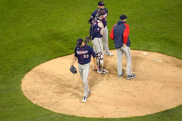 Twins starting pitcher J.A. Happ walks off the mound after being relieved by manager Rocco Baldelli during the fourth inning