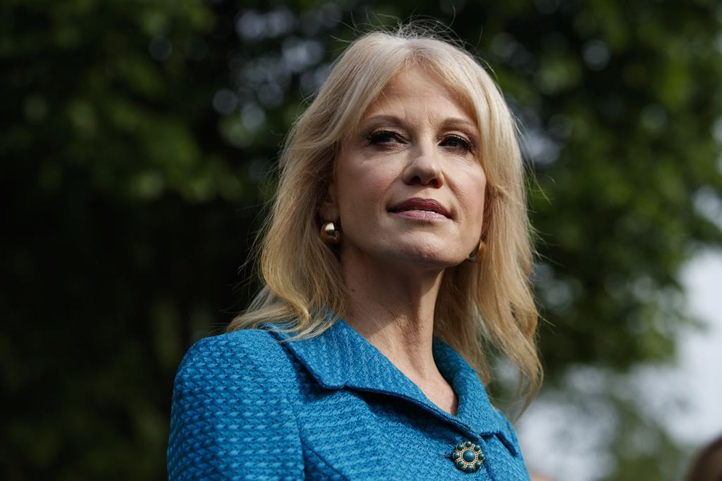 In this April 30, 2019 photo, White House counselor Kellyanne Conway talks with reporters outside the White House in Washington.