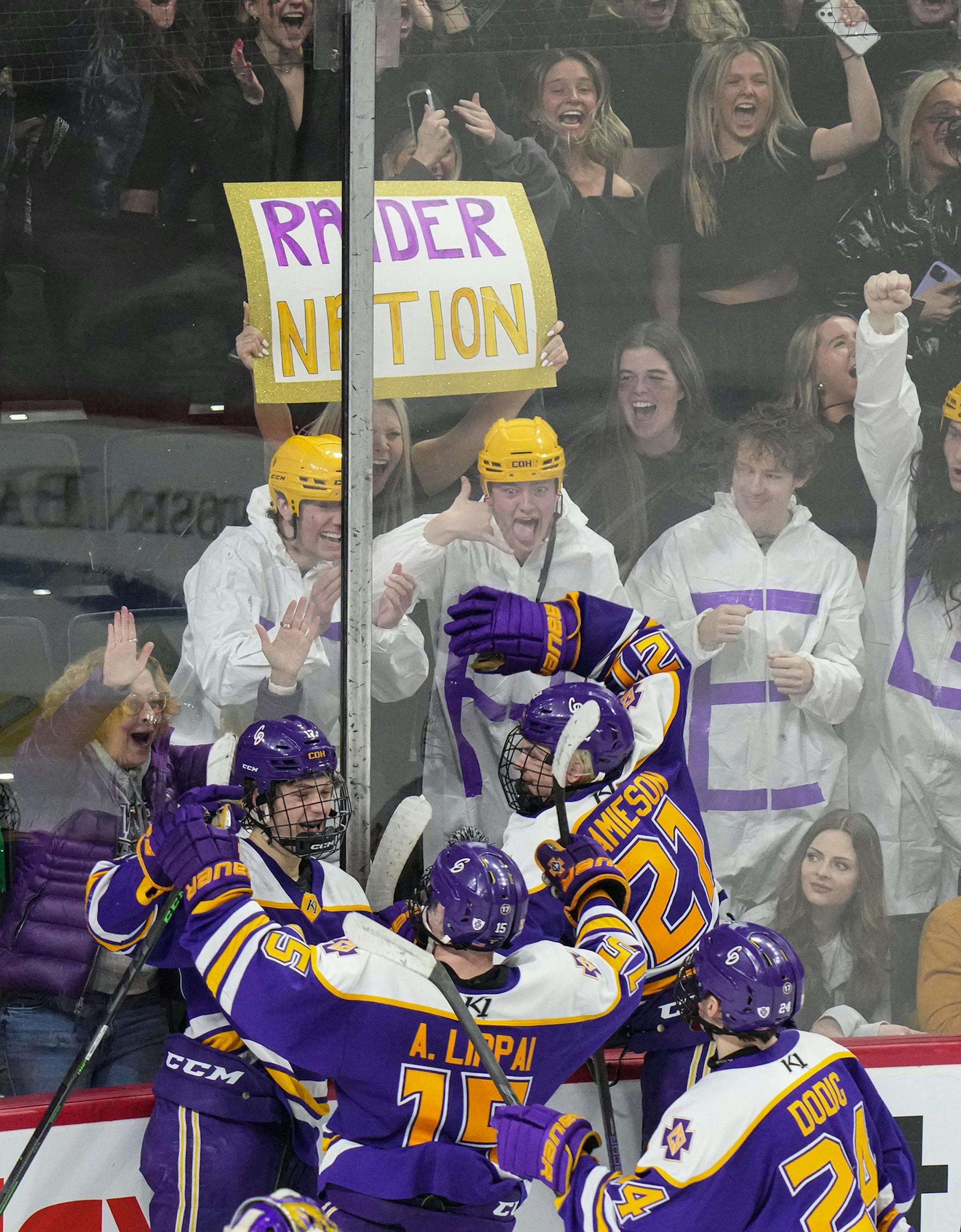 Cretin-Derham Hall players and fans celebrate after the last goal of the game in the third period.