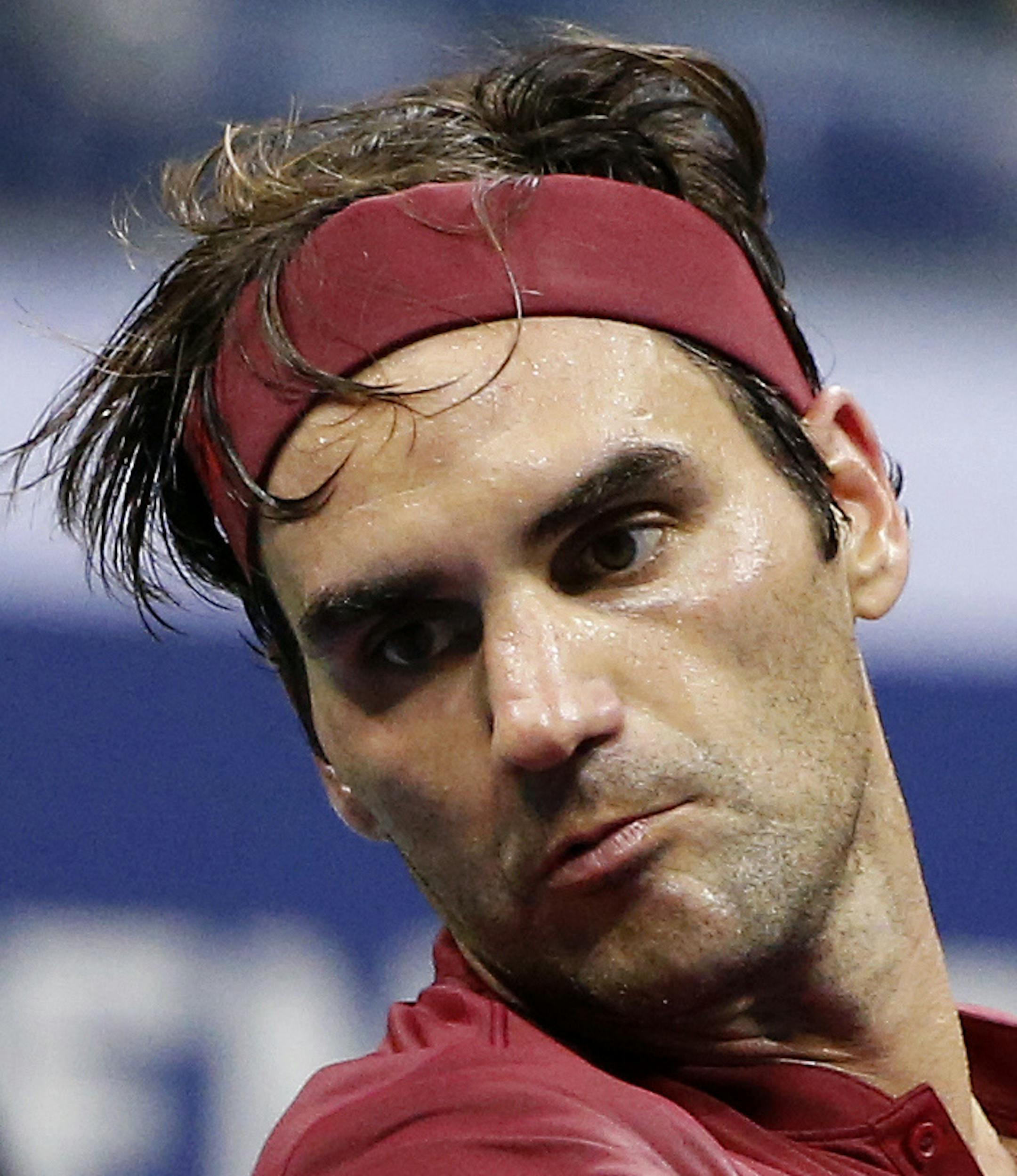 FILE - In this Sept. 4, 2018, file photo, Roger Federer, of Switzerland, returns a shot to John Millman, of Australia, during the fourth round of the U.S. Open tennis tournament in New York. Federer is ranked No. 3 leading into the U.S. Open, where he won the most recent of his five titles there in 2008. (AP Photo/Jason DeCrow, File)