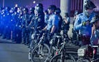 Minneapolis police held a line to box in protesters on Interstate 94 on Nov. 4.