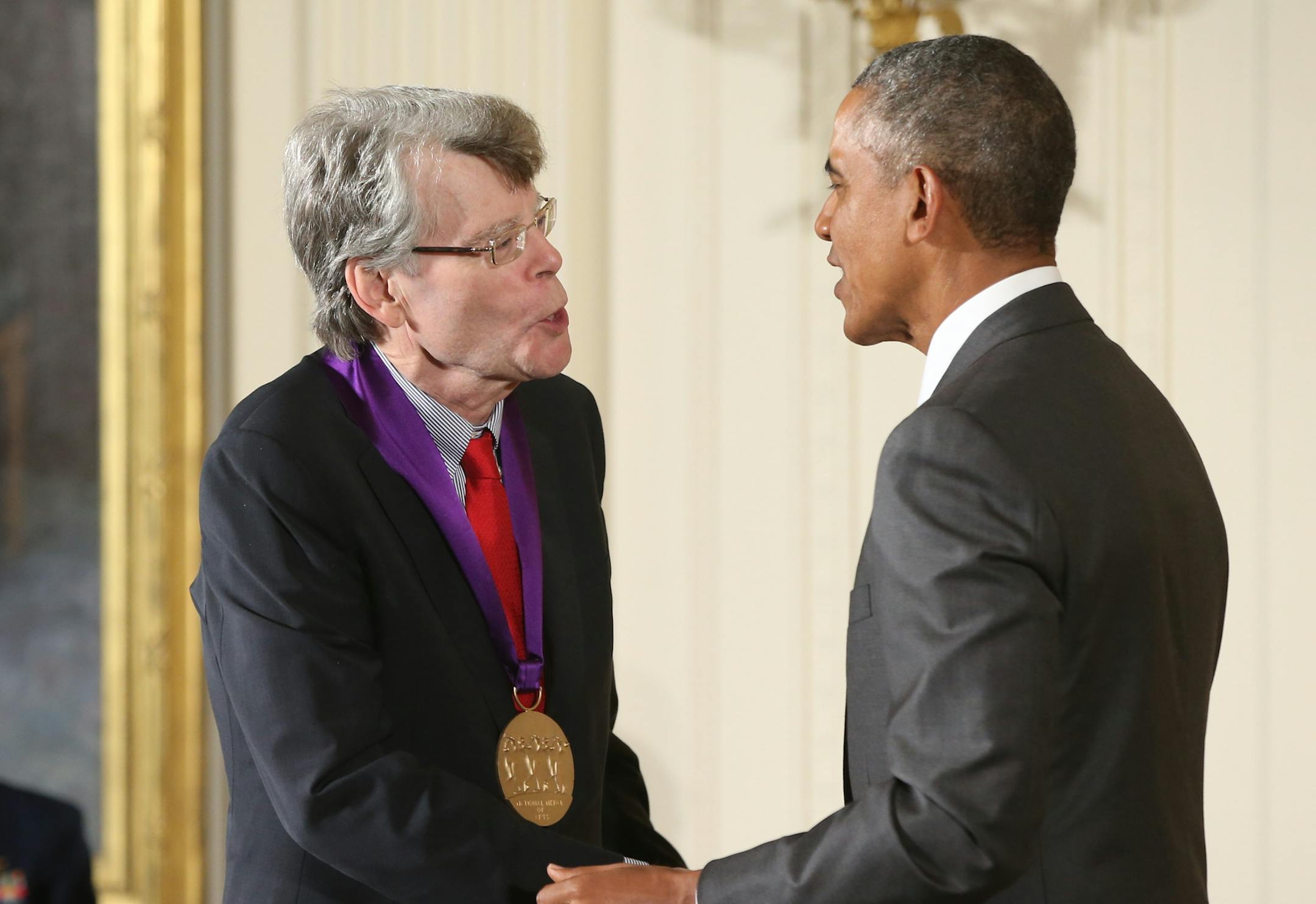 President Barack Obama awards the 2014 National Medal of Arts to author Stephen King, Thursday, Sept. 10, 2015, during a ceremony in the East Room at the White House in Washington. (AP Photo/Andrew Harnik)