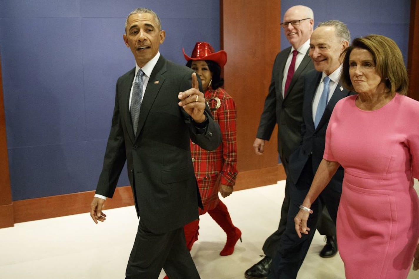 President Obama, Rep. Frederica Wilson, D-Fla., Rep. Joseph Crowley, D-N.Y., Senate Minority Leader Charles Schumer of N.Y., and House Minority Leader Nancy Pelosi of Calif. arrives on Capitol Hill in Washington, Wednesday, Jan. 4, 2017, to meet with members of Congress to discuss his signature healthcare law.