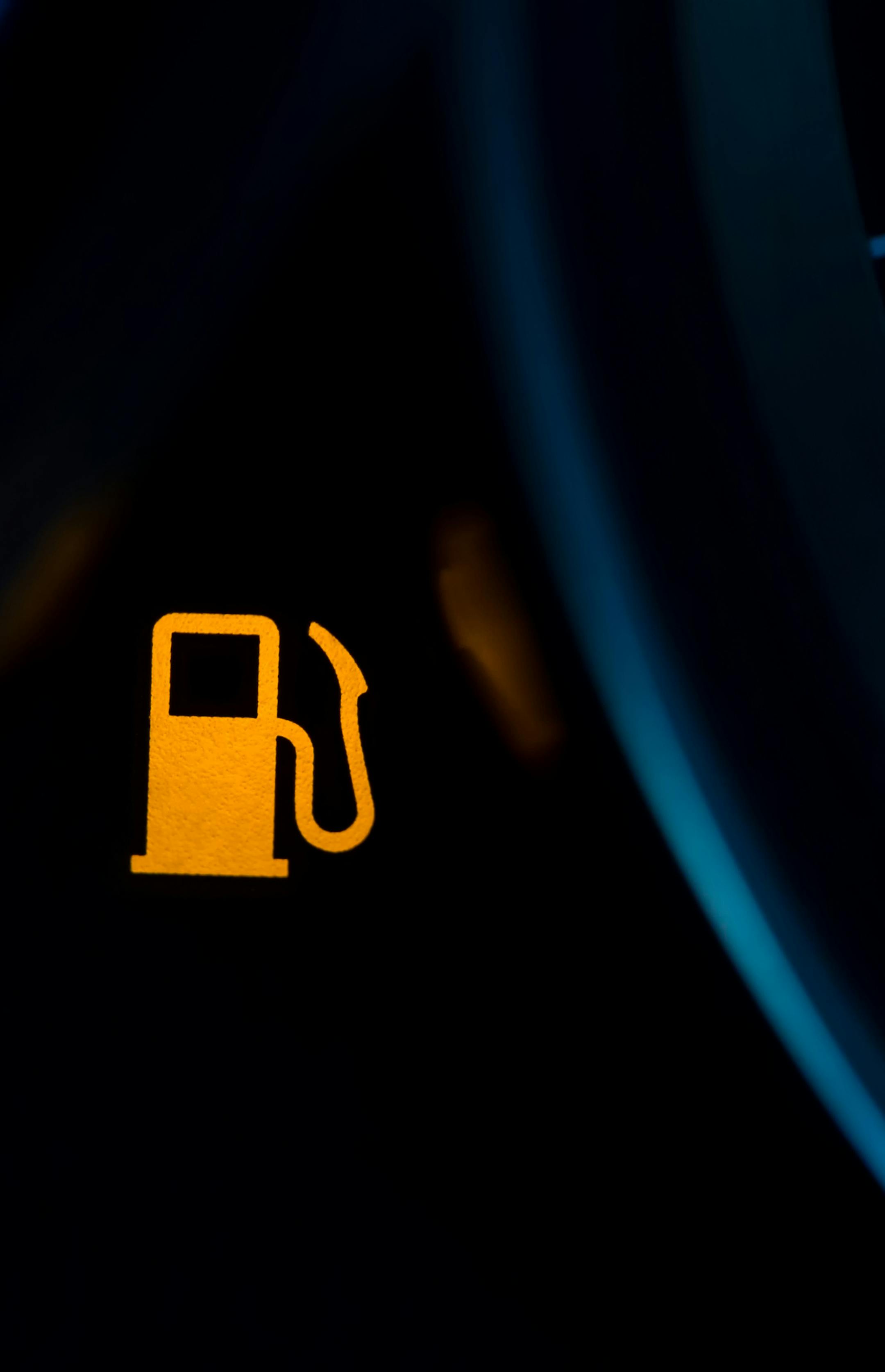 Empty fuel warning light in car dashboard. Fuel pump icon. gasoline gauge dash board in car with digital warning sign of run out of fuel turn on. Low level of fuel show on speedometer dashboard.