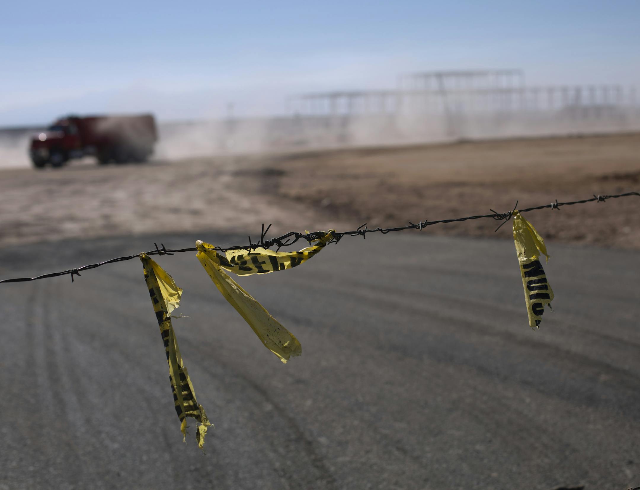 Barbed wire surrounds the site of a cancelled Ford auto manufacturing plant, one day after the U.S. auto company announced the project was called off, in Villa de Reyes, outside San Luis Potosi, Mexico, Wednesday, Jan. 4, 2017. The perception in this region was largely that President-elect Donald Trump, who had promised for months to bring manufacturing jobs back to the U.S. while at the same time disparaging Mexicans, had made good before even settling into the White House. (AP Photo/Rebecca Bl