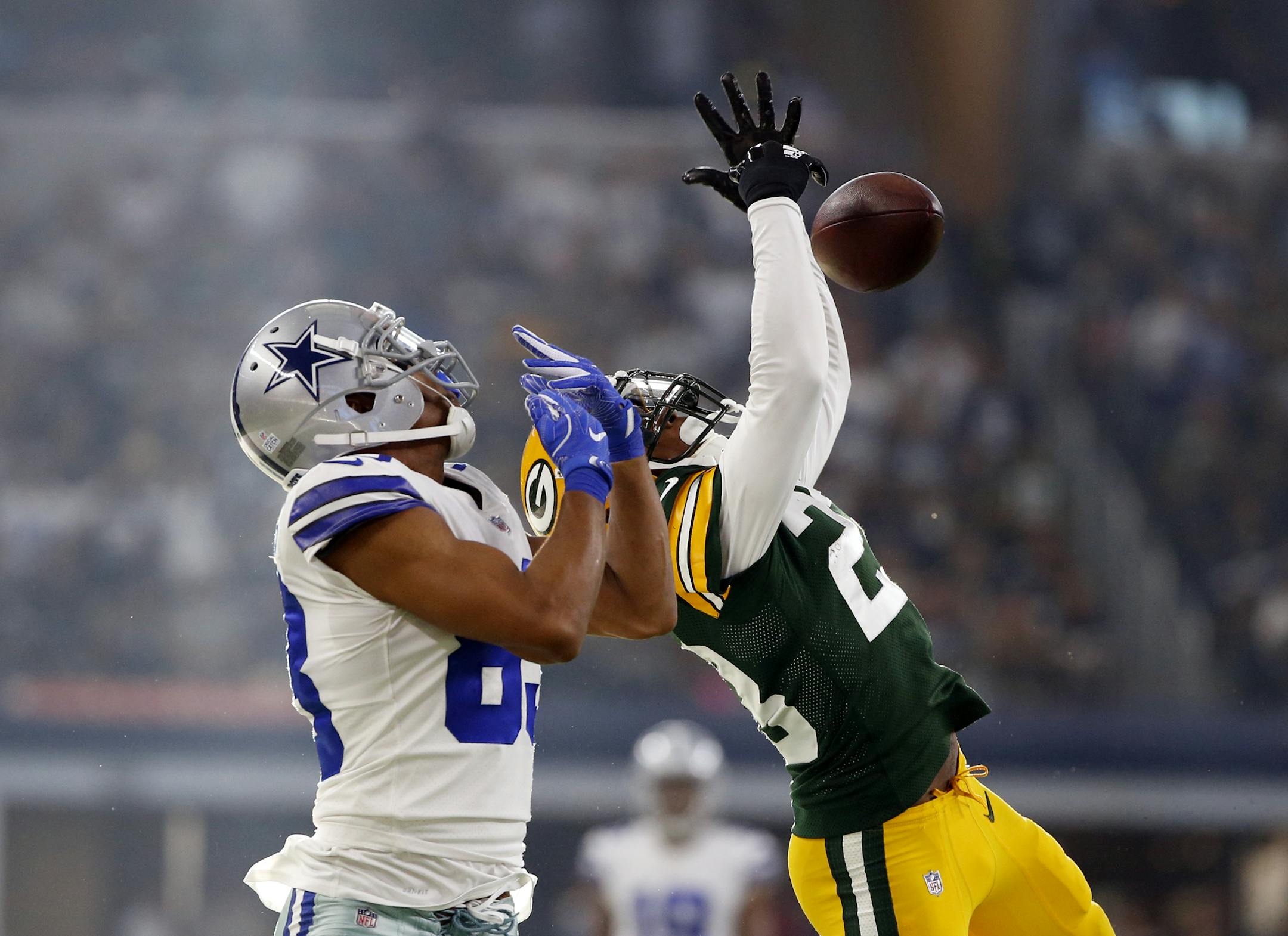 Dallas Cowboys wide receiver Terrance Williams (83) watches as Green Bay Packers cornerback Damarious Randall (23) breaks a pass intended for Williams in late in the second half of an NFL football game, Sunday, Oct. 8, 2017, in Arlington, Texas. (AP Photo/Ron Jenkins)