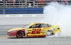 Sprint Cup Series driver Joey Logano (22) smokes his tires after winning the NASCAR Sprint Cup Series auto race at Talladega Superspeedway Sunday, Oct