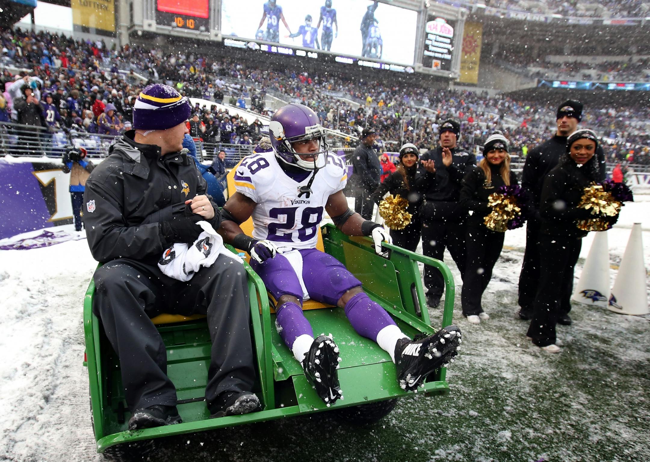Minnesota Vikings running back Adrian Peterson (28) was carted off the field in the second quarter.