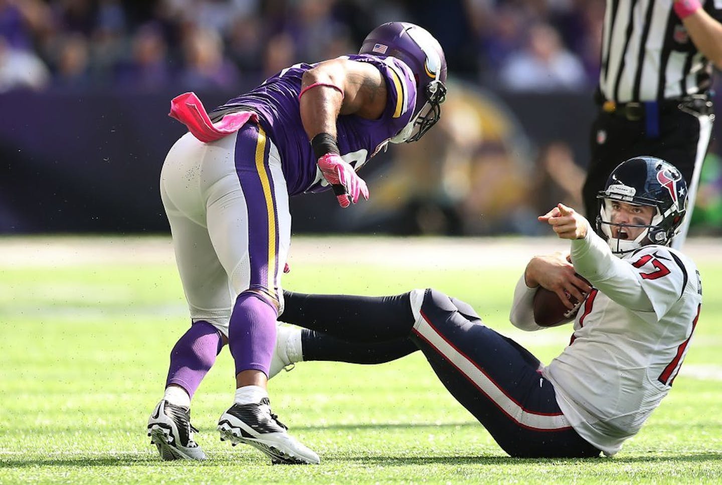 Houston Texans quarterback Brock Osweiler looks for a penalty call on outside linebacker Anthony Barr as he gets pressure by Minnesota Vikings defensive end Everson Griffen in the second quarter as they took on the Houston Texans at US Bank Stadium, Sunday, October 9, 2016 in Minneapolis, MN.