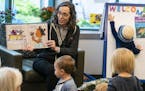 St. Paul Public Library Director Catherine Penkert read a book during children's story time at the Highland Park Library on Tuesday, Sept. 9.