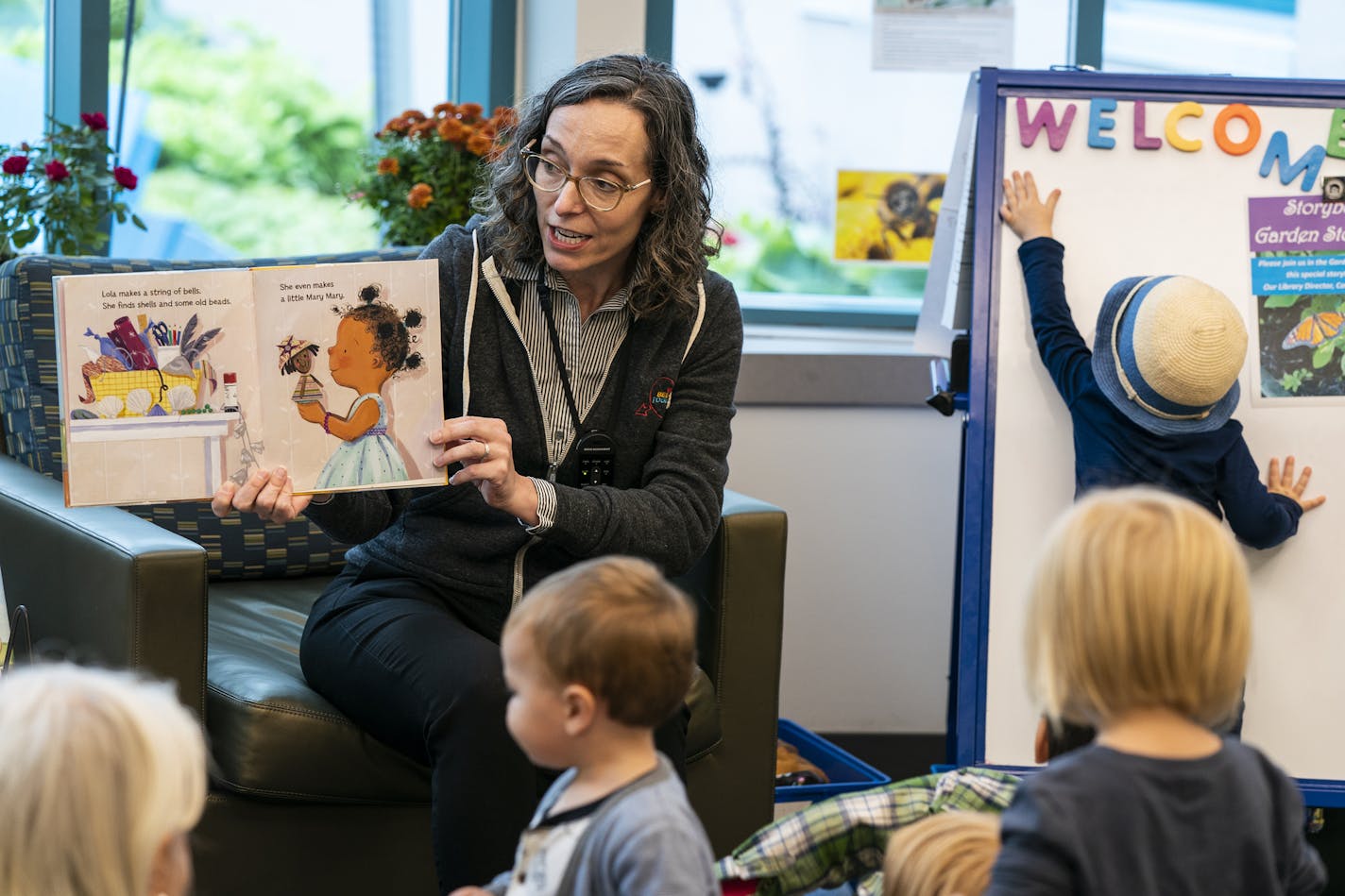 St. Paul Public Library Director Catherine Penkert read a book during children's story time at the Highland Park Library on Tuesday, Sept. 9.