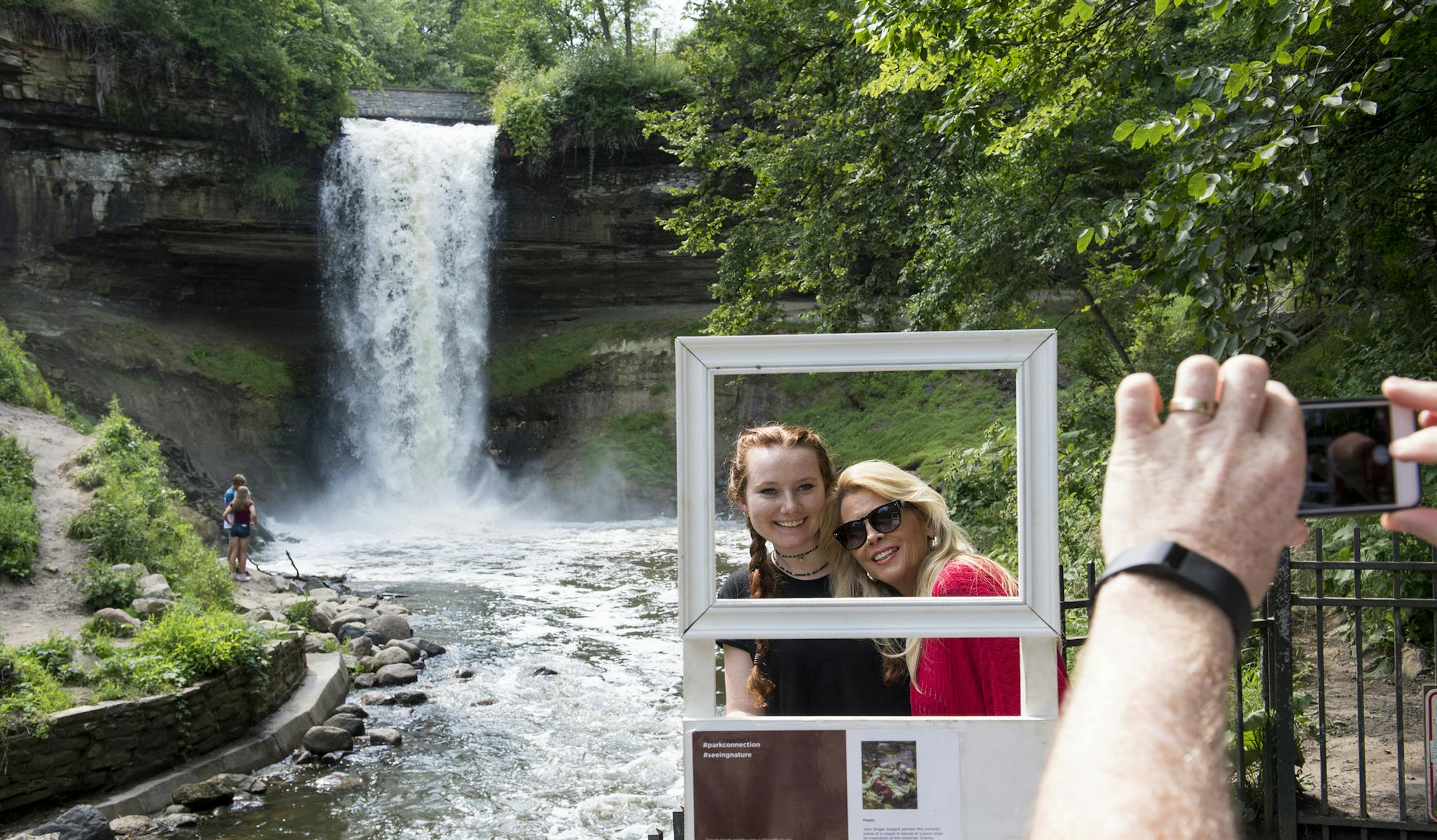 Julayne Kilcullen, 15, and her mother, Tyra Kilcullen, of the Denver area had their picture taken by Chris Kilcullen at Minnehaha Falls in south Minneapolis.