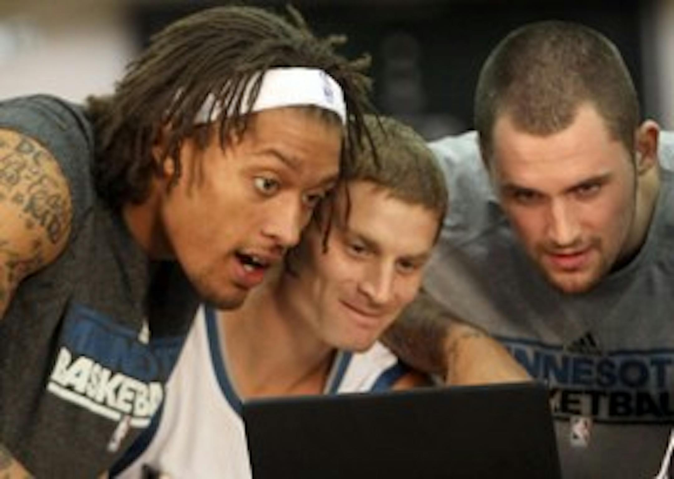 Michael Beasley, Luke Ridnour and Kevin Love -- not reading Love's blog