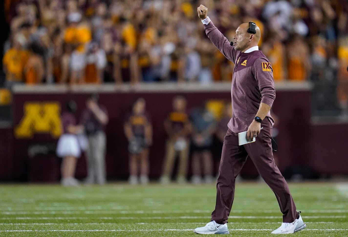 Minnesota head coach P. J. Fleck signals to his team during the first half of an NCAA college football game against New Mexico State Thursday, Sept. 1, 2022, in Minneapolis. (AP Photo/Abbie Parr)