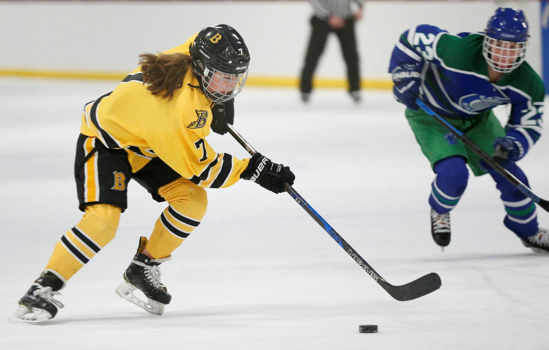 Burnsville's Allie Urlaub (7) races toward the Eagan net on a shorthanded scoring play late in the first period Wednesday night. Urlaub’s goal gave Burnsville a 1-0 lead. Photo by Jeff Lawler, SportsEngine