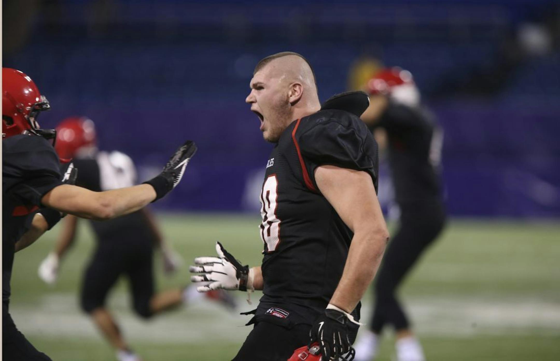 Eden Prairie's Tyson Reinke celebrated after their teams win over Minnetonka during the class 6A quarterfinals at Mall of America Field in Minneapolis, Min., Friday November 9, 2012. Eden Prairie won 21-18.