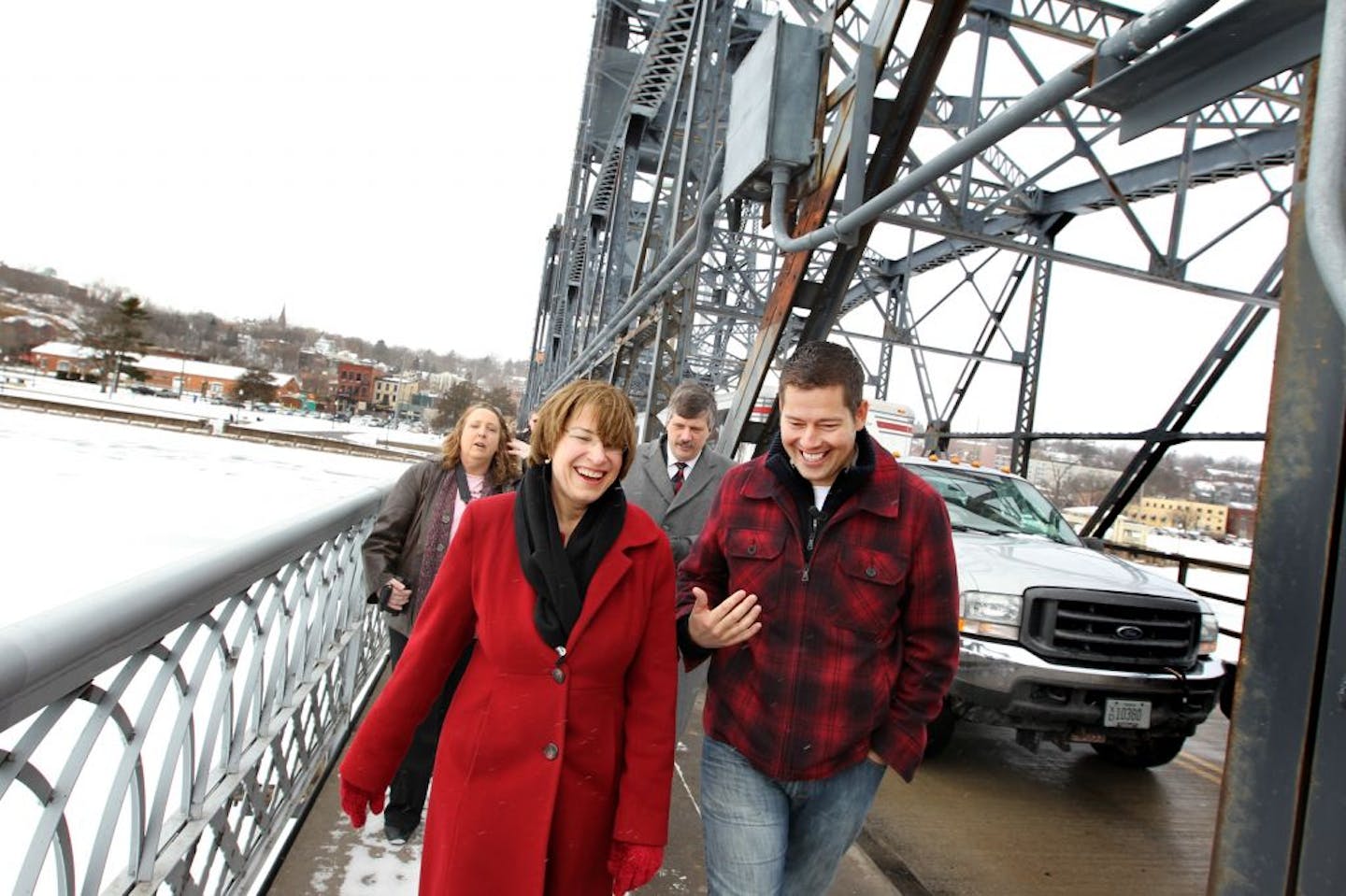 Right to left, Rep. Sean Duffy, Stillwater Mayor Ken Harycki, and U.S. Senator Amy Klobuchar led a group walk across the Stillwater Lift Bridge during a community gathering to discuss the next steps for a new St. Croix River bridge between Minnesota and Wisconsin in Stillwater March 3, 2012. Final passage of federal legislation clears the way for construction of the bridge.