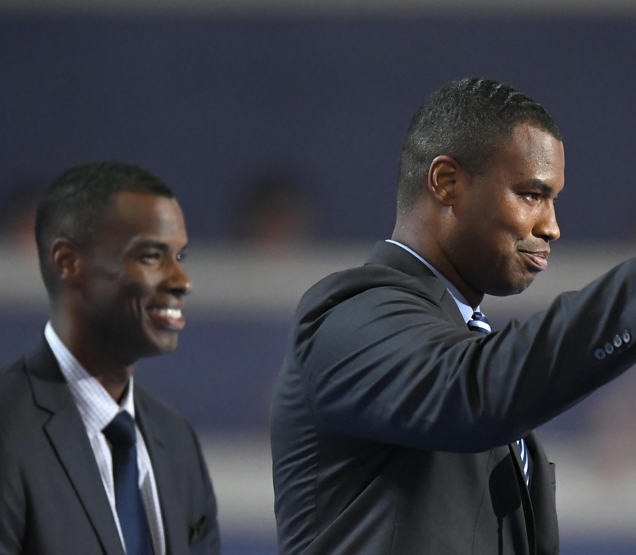 Jason Collins waves while speaking alongside his brother Jarron during the first day of the Democratic National Convention in Philadelphia , Monday, July 25, 2016. (AP Photo/Mark J. Terrill)