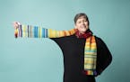 Lorri Talberg shows off her knit "temperature scarf" that depicts the weather in 2014. Photographed in Minneapolis, Minn., on Tuesday, February 12, 20